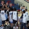 land--A coach high-fives one of his players during a team huddle at an Upward basketball game.