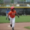 land--A boy runs to third base during a little league baseball game.